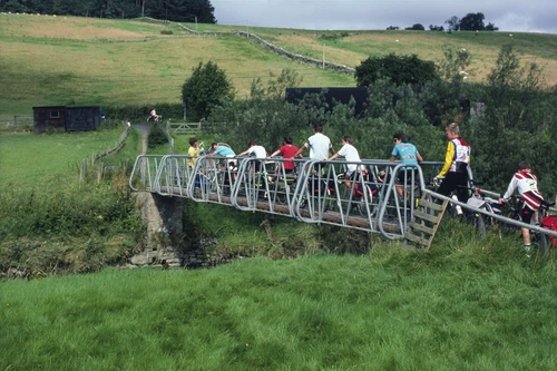 30 Aug 1987 · Crossing the Borthwick Water footbridge from Snoot’s meadow, heaving touring bikes back to the road.
