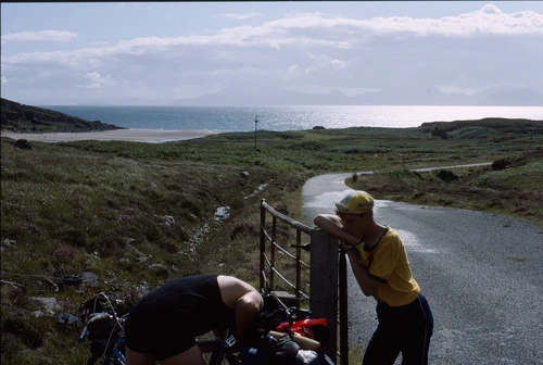25 Aug 1988 · Graham and (probably) Jason post-dune-hopping at Sand Beach car park. Beach left, MoD BUTEC road right; Raasay and the Cuillin beyond.