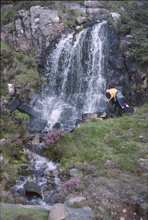 25 Aug 1988 · Graham cools off in the waterfall near A’ Bhainlir, approaching Ardheslaig—twenty miles in.