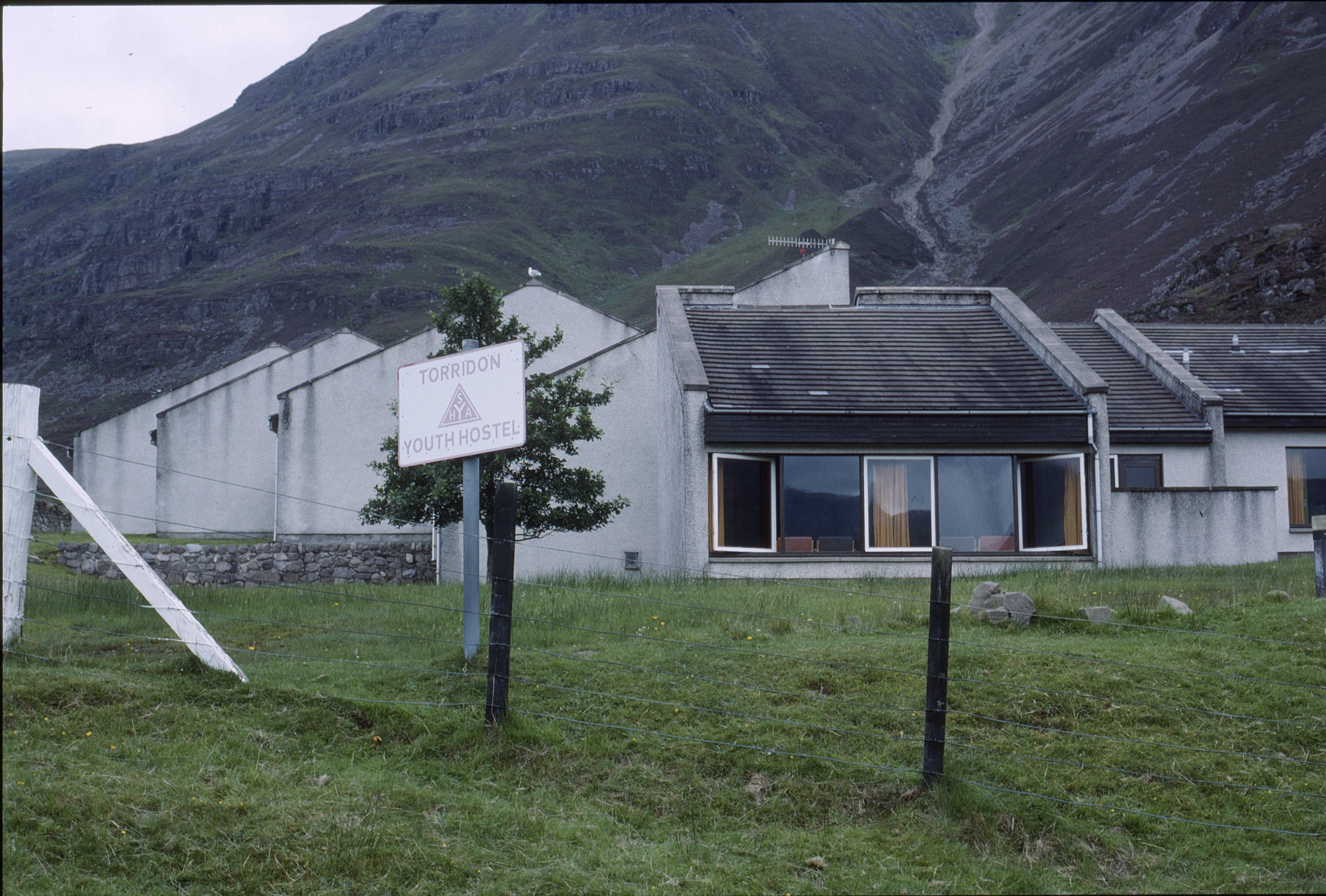 Torridon Youth Hostel: low, modernist SYHA, purpose-built in 1975, tucked beneath steep Torridon hills, overlooking Upper Loch Torridon.