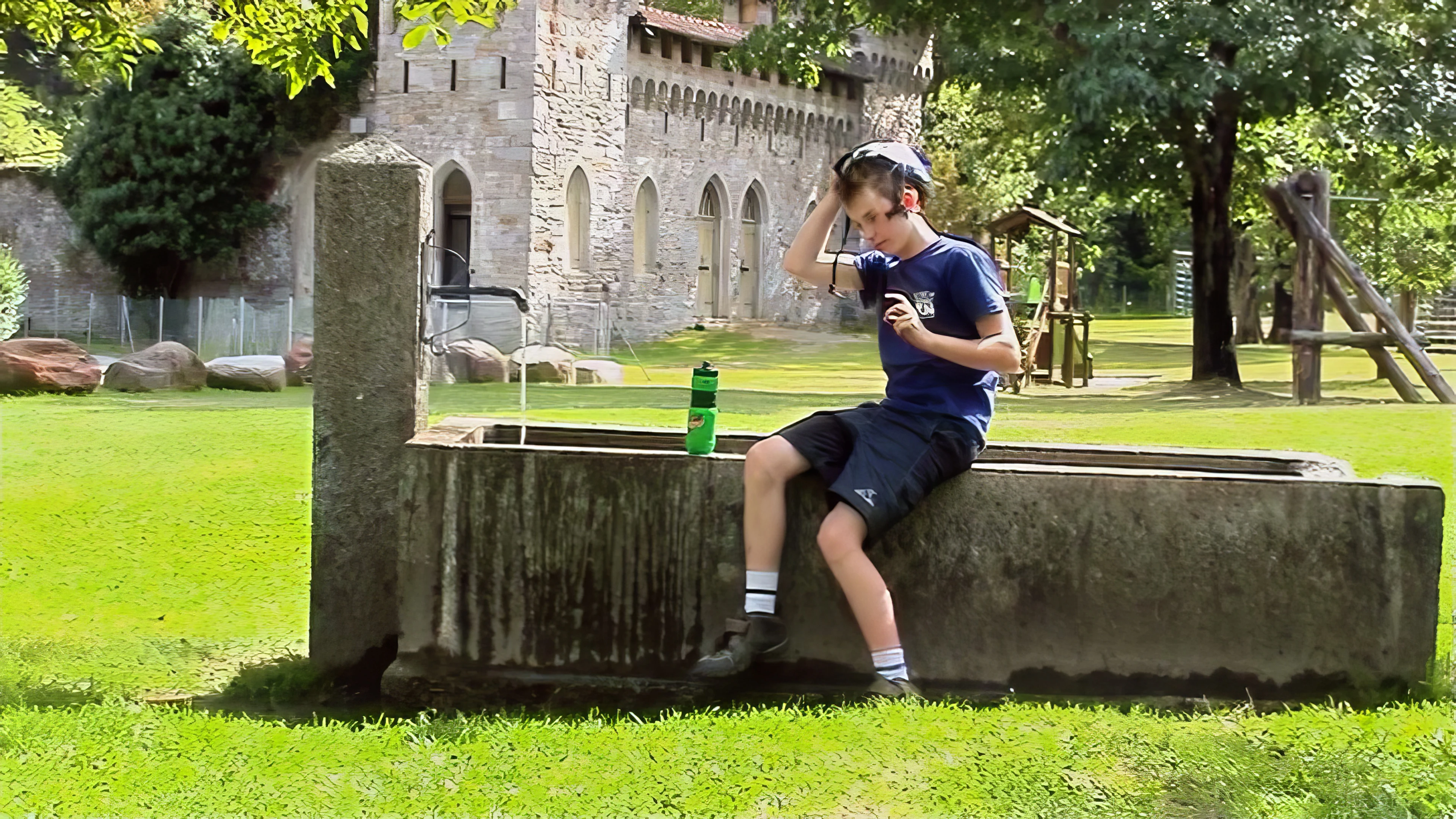 Joe ponders a cool-down at Via Gerra playground, Faido—31.5 miles in
