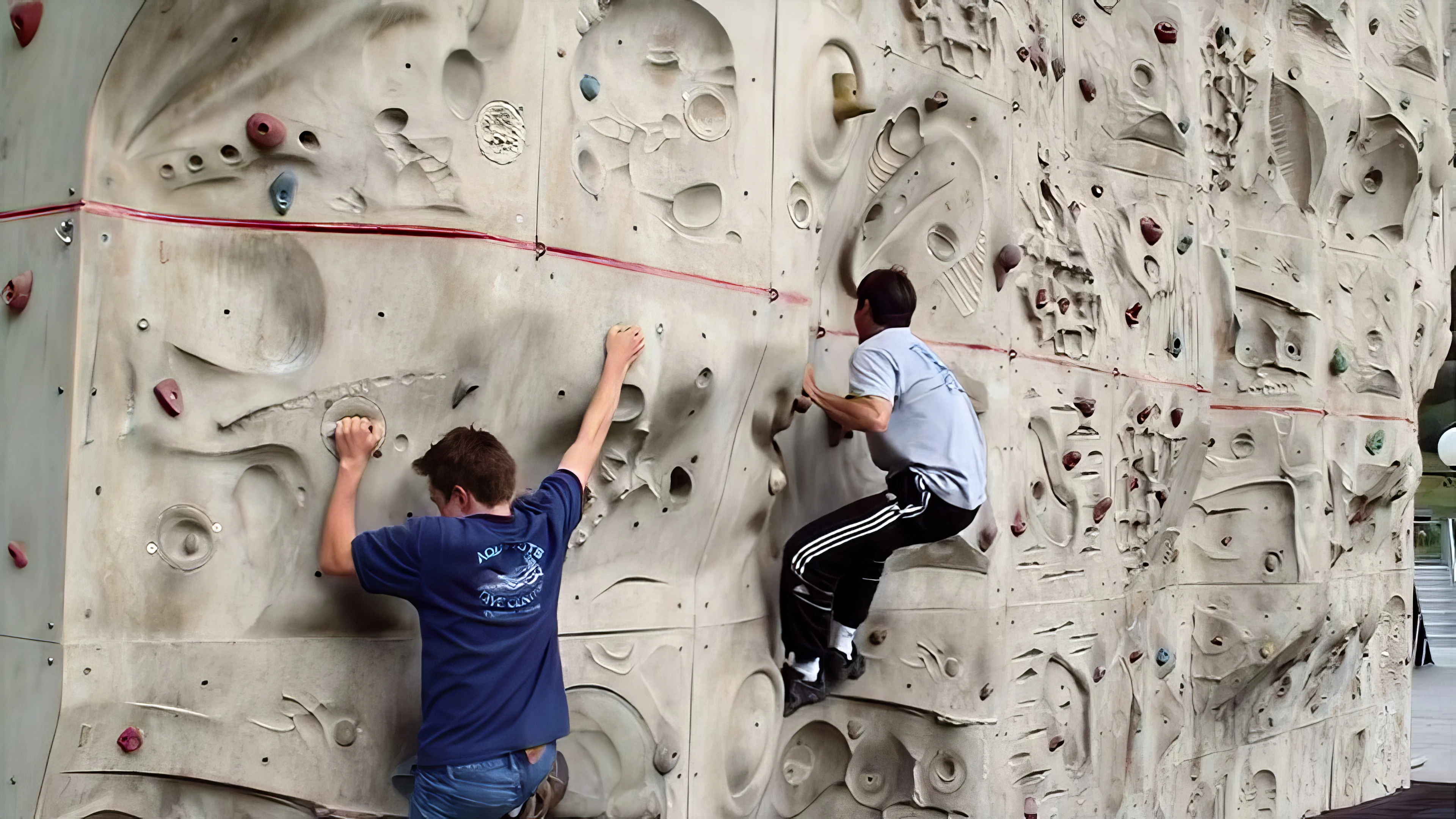 Joe and Tao try their hand at the climbing wall