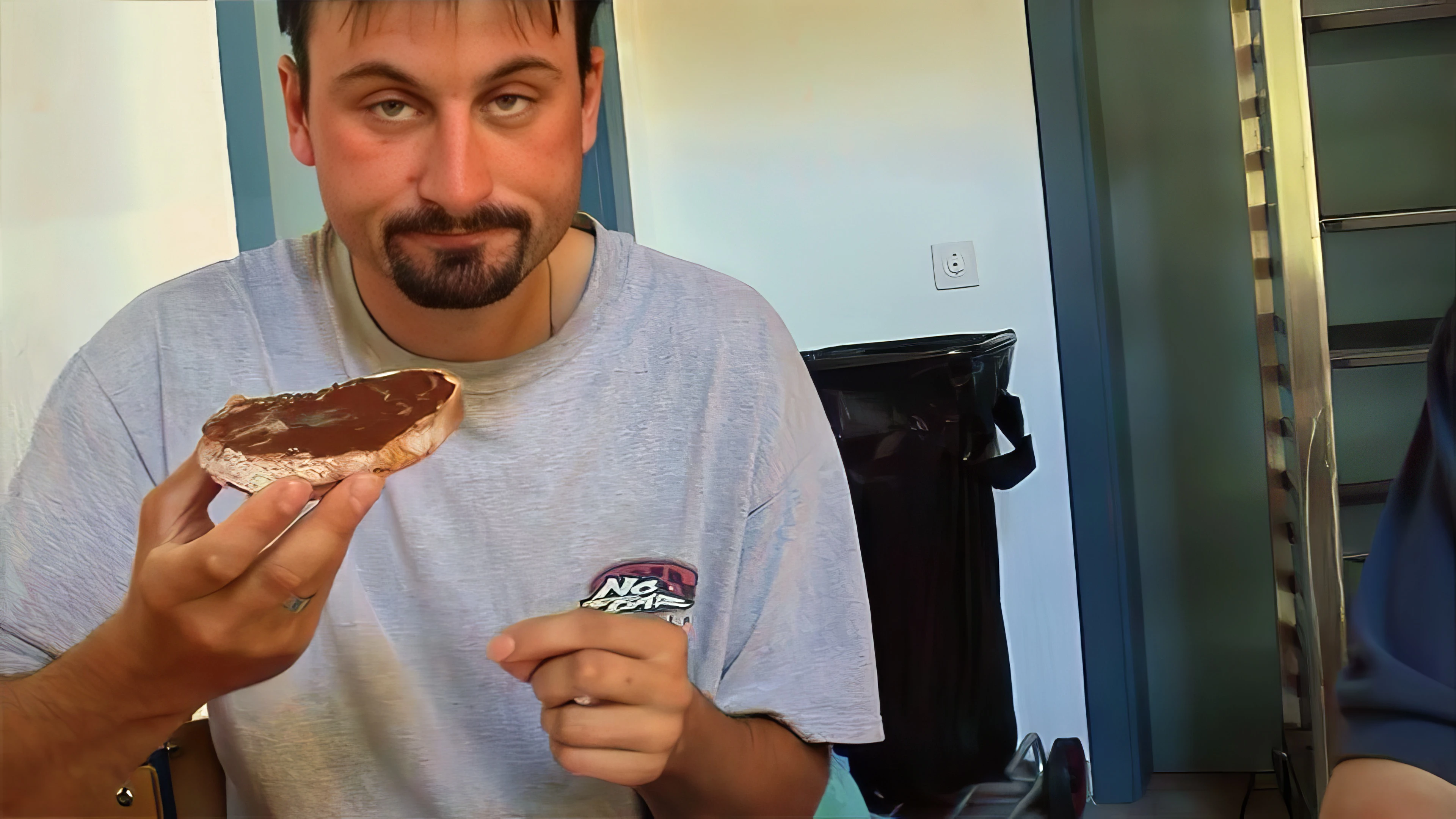 Tao enjoys Nutella on wholemeal at Sion hostel breakfast.