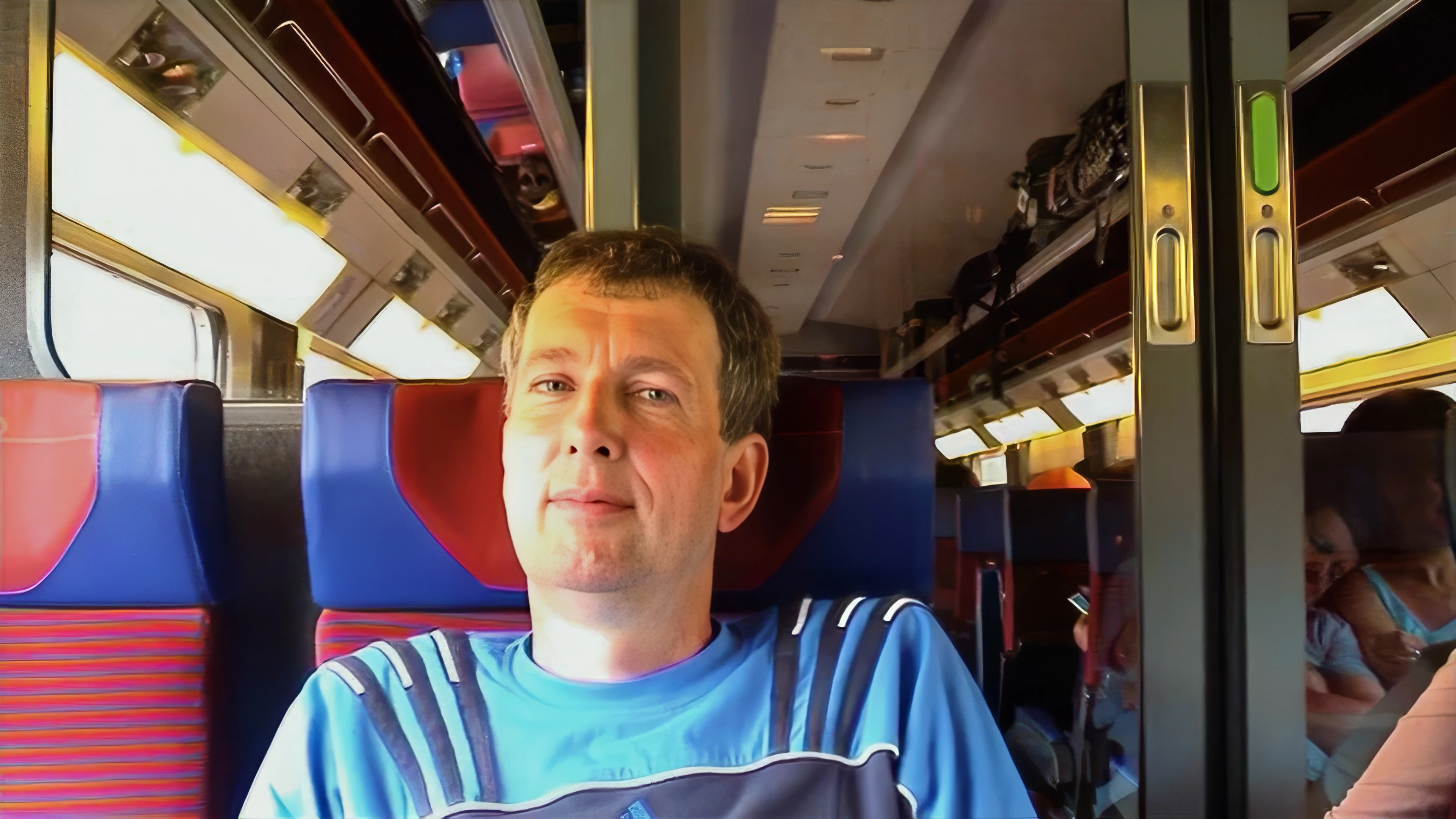 Michael keeps an eye on Joe larking about with the camcorder on the 09:22 TGV to Paris.