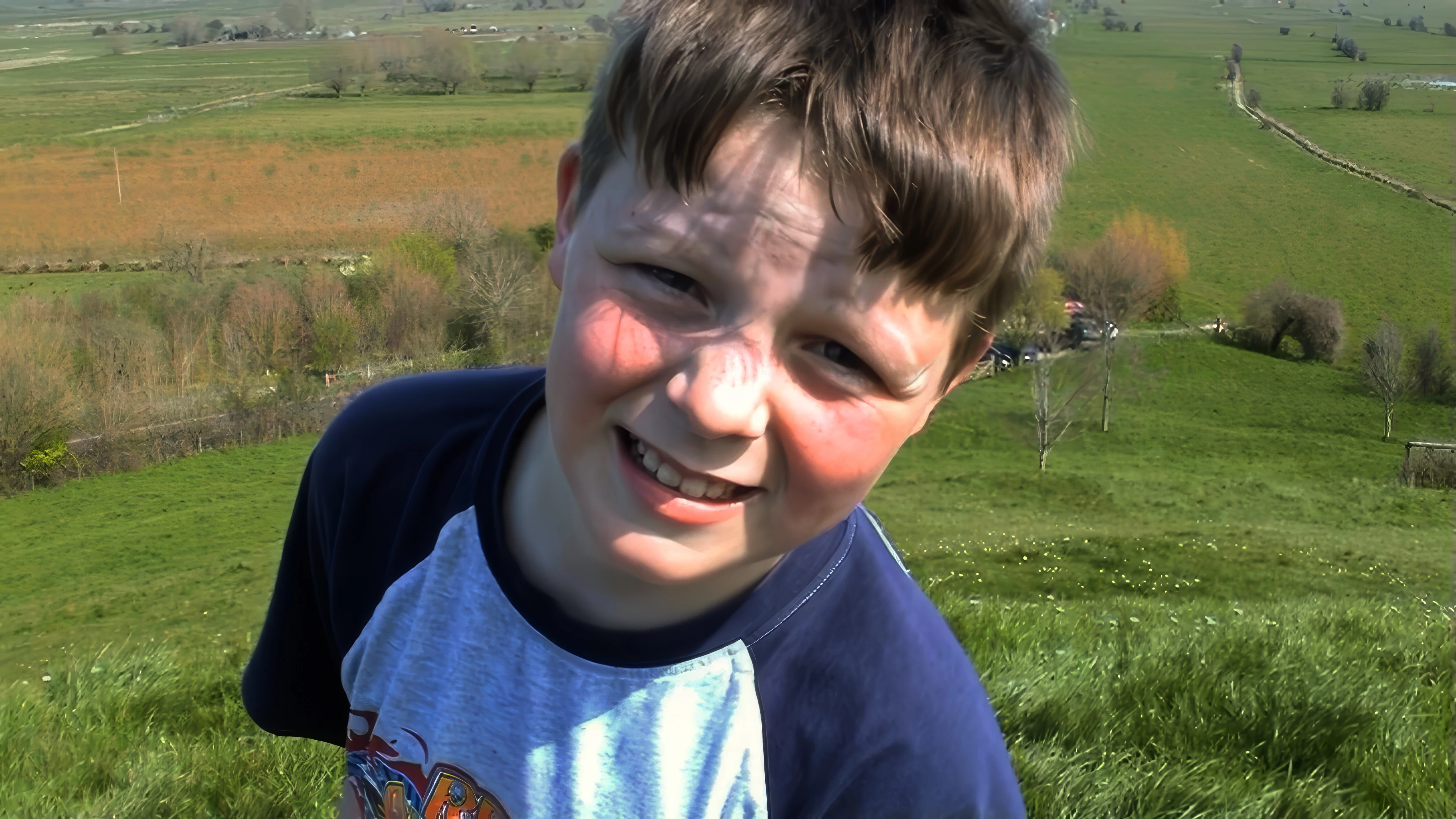 Ash introduces himself on camera after rolling down Burrow Mump.