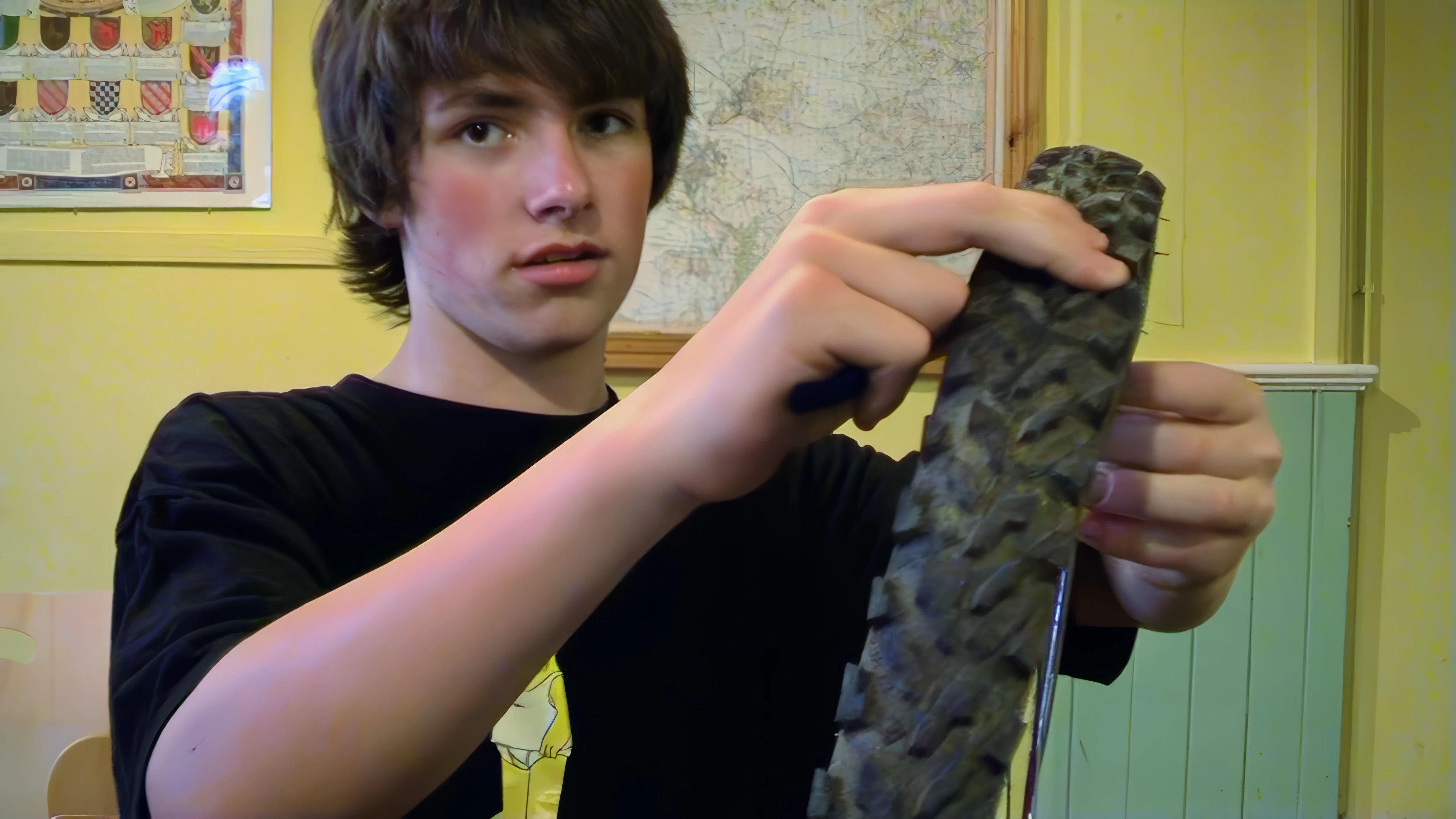 Matt starts repairing his puncture in Street Youth Hostel.