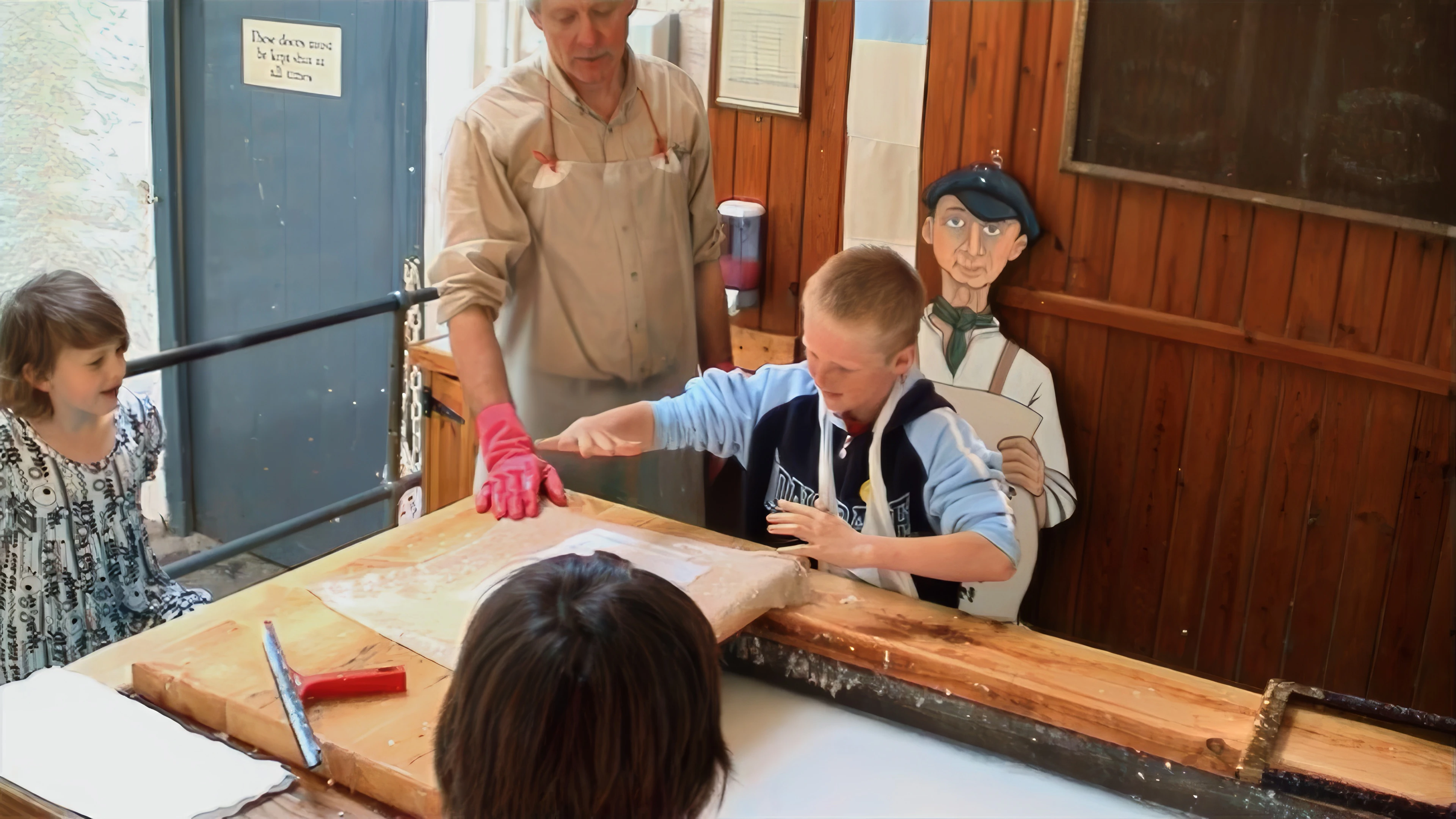 Alex adds a handprint watermark to his sheet.