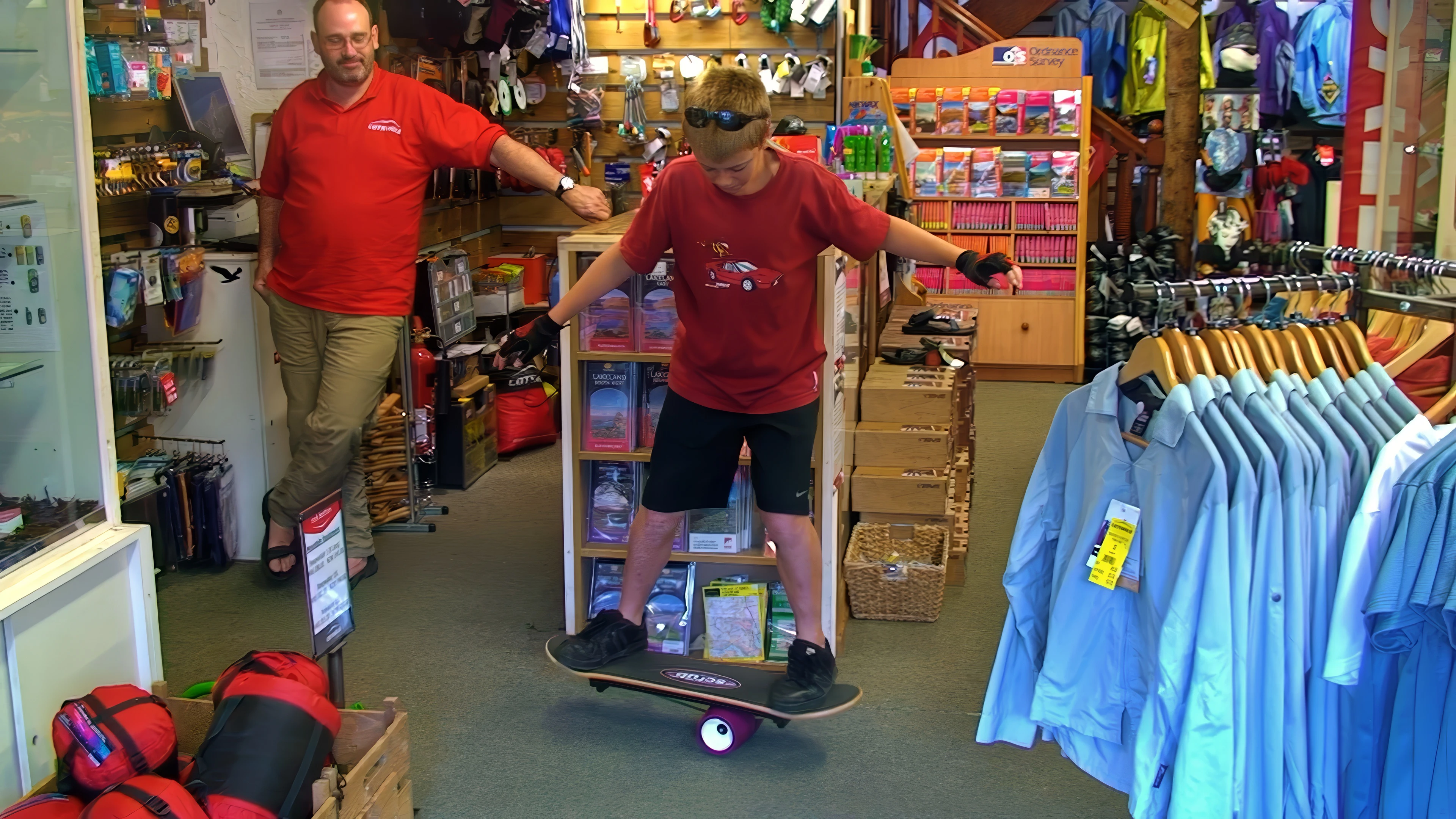 Sam masters the one-wheel board in Cotswold Outdoor, Grasmere.
