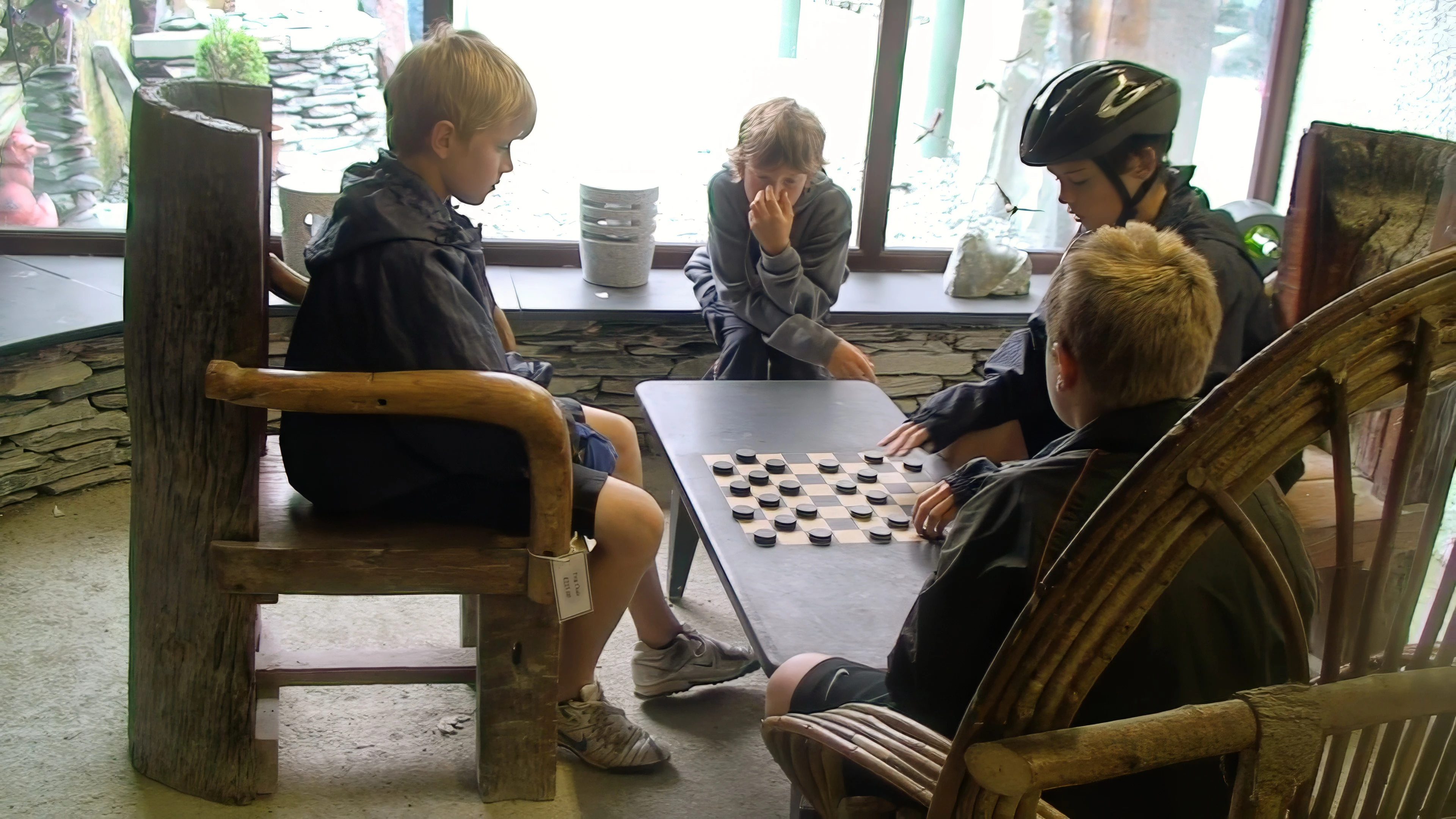 Olly and Freddie play slate draughts at Honister Slate Mine.