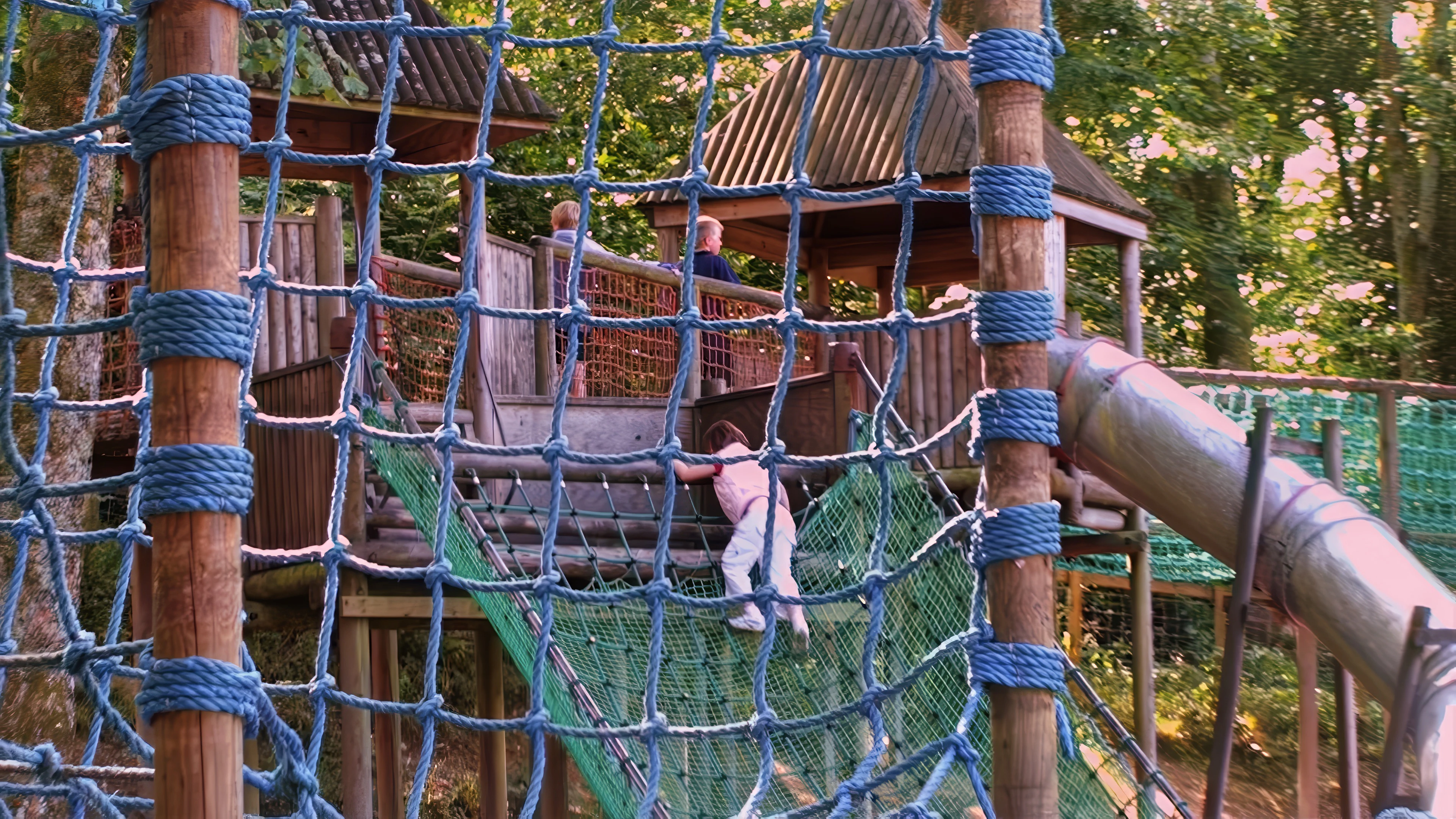 Sam and Olly test the adventure playground at the Lakeland Visitor Centre, Windermere.