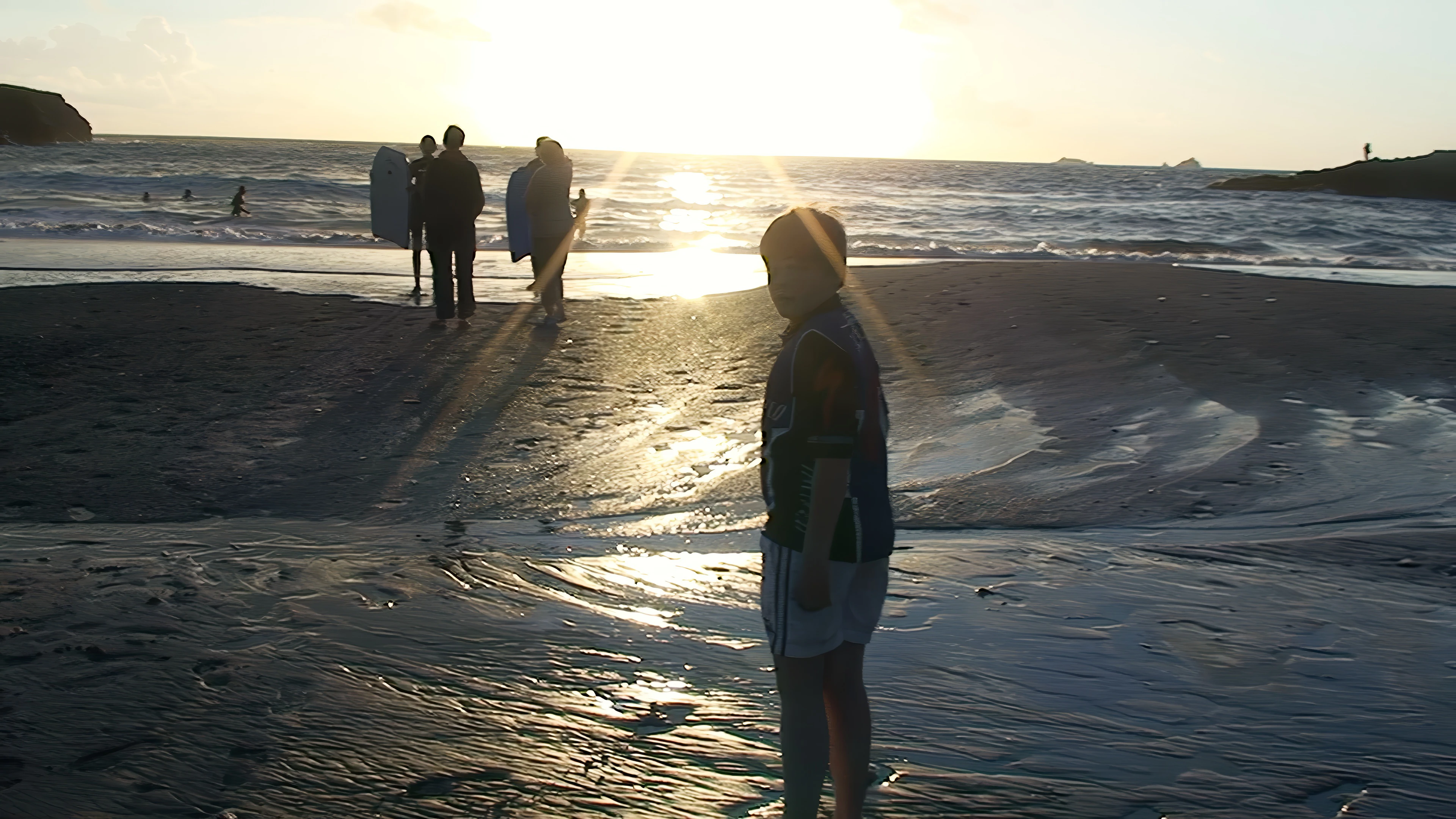 Ash heading out for an evening swim at Treyarnon Bay.