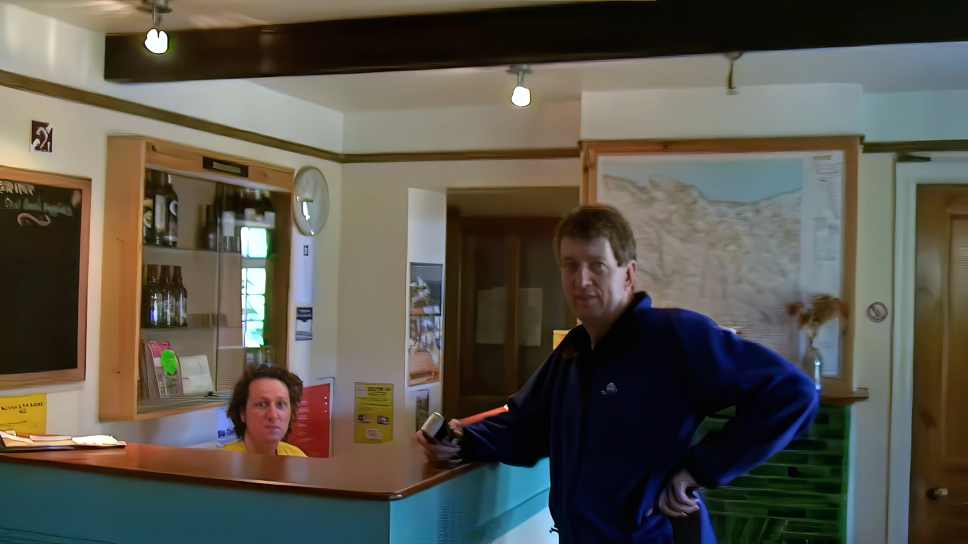 Michael at Minehead Youth Hostel reception, caught during Ash's video tour