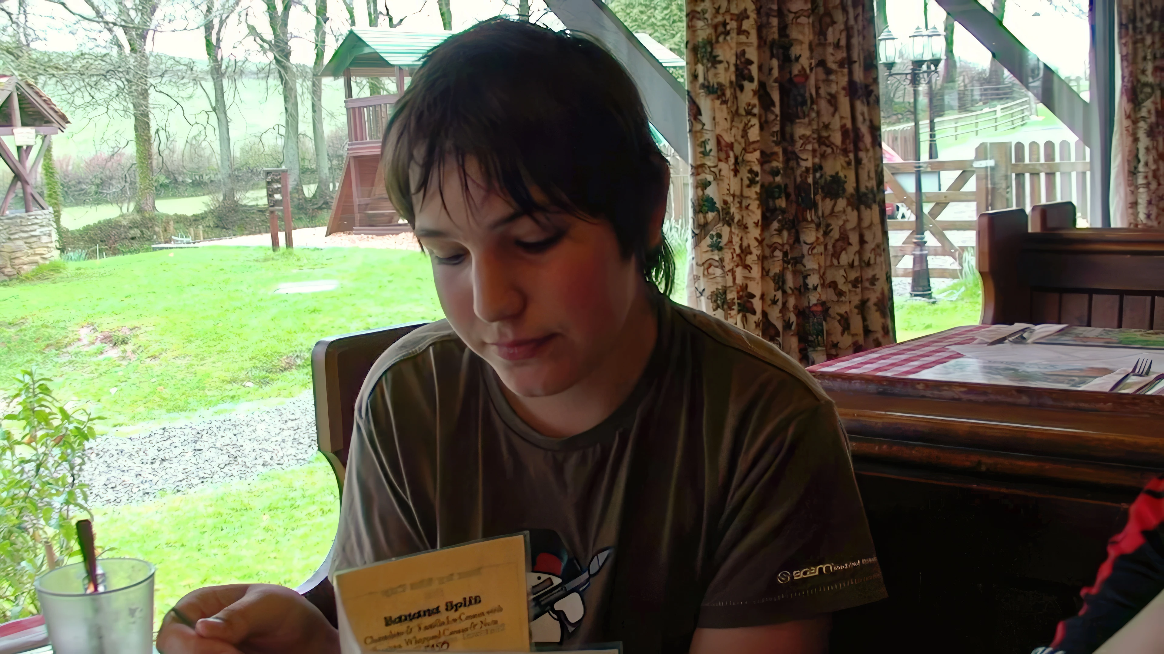 Zac enjoys sticky toffee pudding at the Old Station House Inn—well-earned after the wet climb.