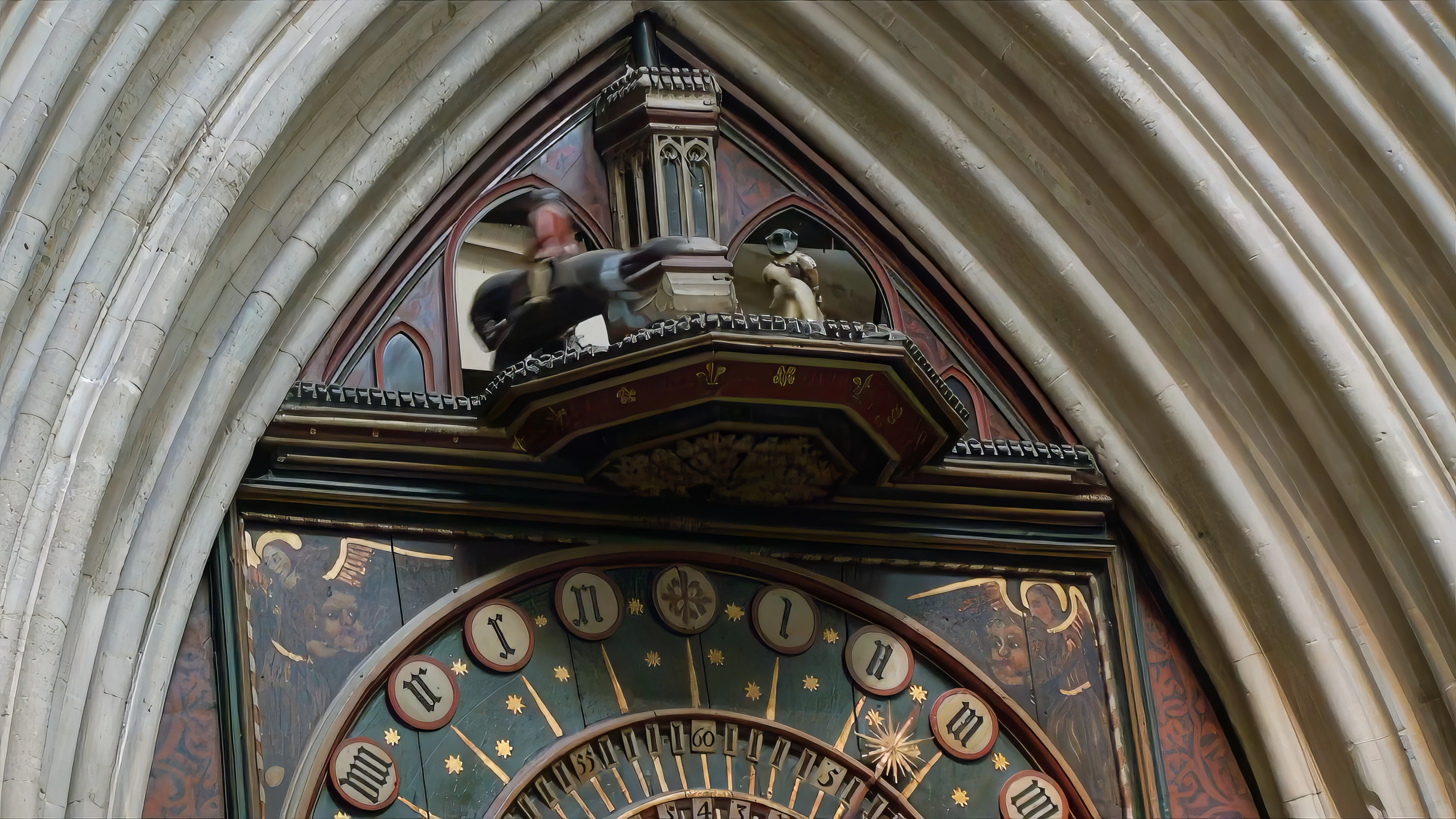 Wells Cathedral’s famous clock strikes 2.30, sending the jousters out